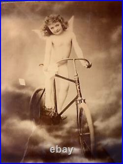 Antique 1896 Reverse Lithograph on Glass J Arthur Cherub Angel on Bicycle Heaven