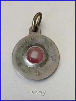 Antique Religious Fabric Relic in a silver medal container Ex Indumentis 1.5cm