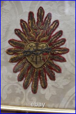 Antique religious plaque with lithurgical brocade bleeding hearth inside