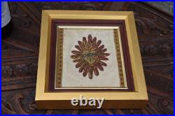 Antique religious plaque with lithurgical brocade bleeding hearth inside