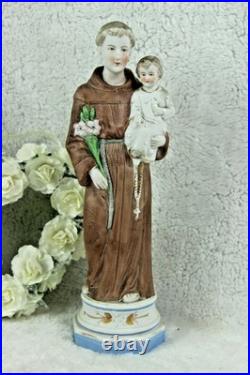 Antique religious porcelain bisque figurine of saint anthony with child Antique religious porcelain bisque figurine of saint anthony with child
