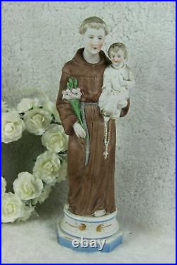 Antique religious porcelain bisque figurine of saint anthony with child