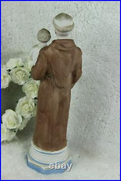 Antique religious porcelain bisque figurine of saint anthony with child