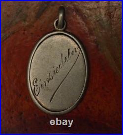 Antique religious silver engraved medal pendant of The Holy Lady of Einsiedeln