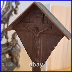 Antique religious table stand with crucifix