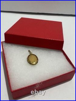 This vintage gold reliquary is a classic piece of jewelry designed to store 14k
