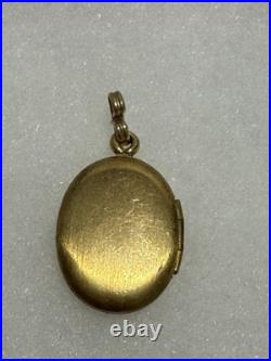 This vintage gold reliquary is a classic piece of jewelry designed to store 14k