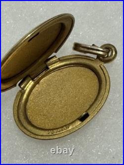This vintage gold reliquary is a classic piece of jewelry designed to store 14k