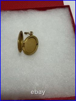 This vintage gold reliquary is a classic piece of jewelry designed to store 14k
